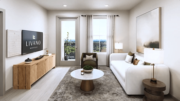 a living room with a white couch and a table